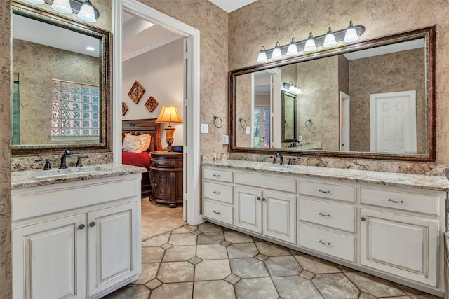 bathroom with vanity, plenty of natural light, and crown molding