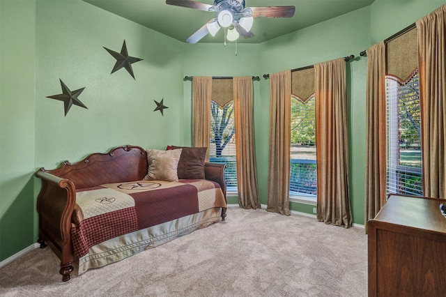 bedroom with light colored carpet and ceiling fan