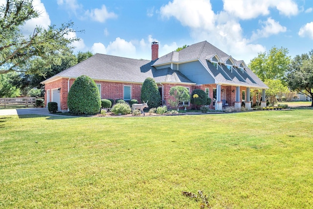 view of front facade featuring a garage and a front lawn