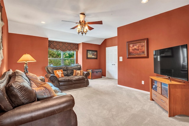 carpeted living room with vaulted ceiling and ceiling fan