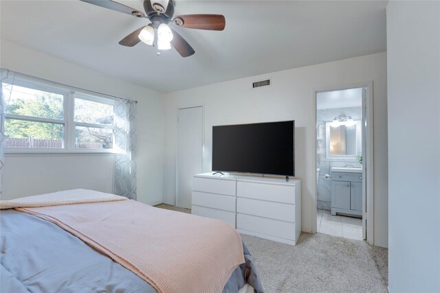 foyer entrance with light tile patterned floors and ceiling fan