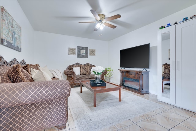 living room with light tile patterned floors and ceiling fan