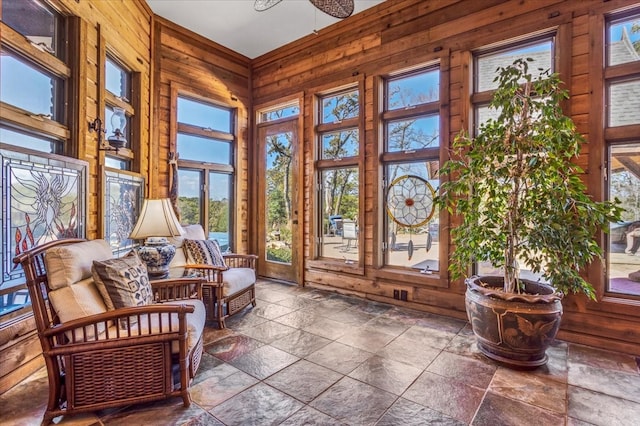 sunroom / solarium featuring a healthy amount of sunlight