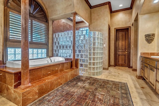 bathroom with vanity, ornamental molding, and tiled bath