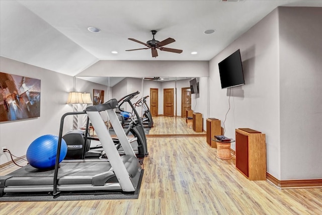 workout area with hardwood / wood-style flooring, ceiling fan, and lofted ceiling