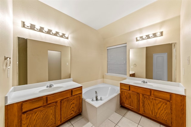 bathroom featuring tile patterned floors, a tub to relax in, vanity, and lofted ceiling