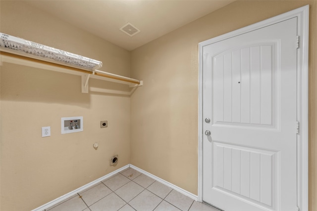 laundry area with hookup for an electric dryer, washer hookup, hookup for a gas dryer, and light tile patterned flooring