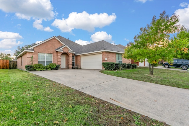 single story home with a front yard and a garage