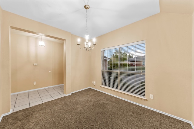 unfurnished room with carpet floors, an inviting chandelier, and lofted ceiling