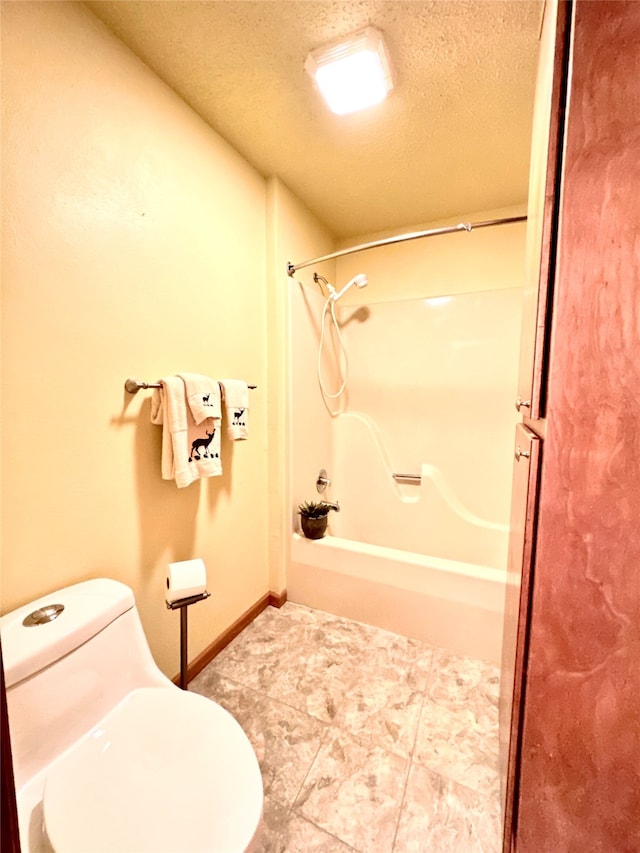 bathroom with tile patterned floors, shower / tub combination, a textured ceiling, and toilet