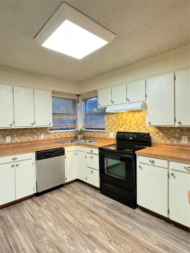 kitchen featuring sink, light hardwood / wood-style flooring, black electric range oven, stainless steel dishwasher, and white cabinets