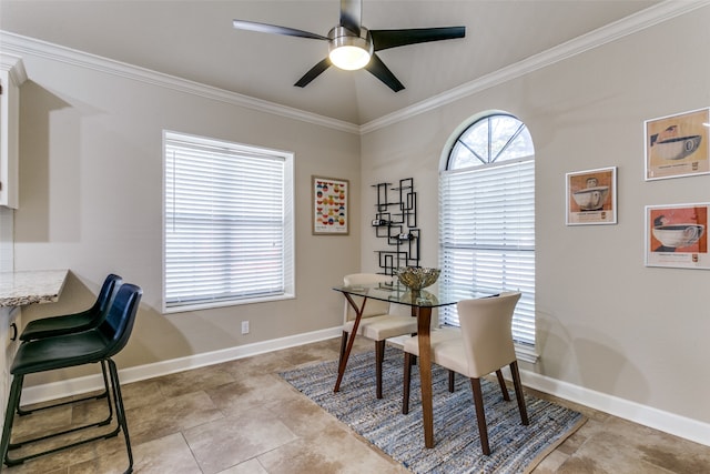 dining room with ceiling fan and ornamental molding