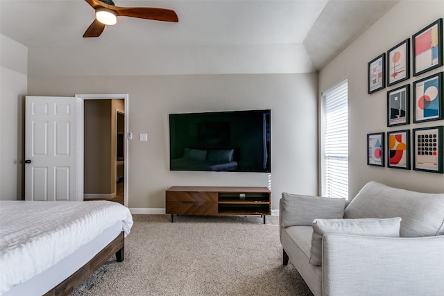 carpeted bedroom featuring vaulted ceiling and ceiling fan