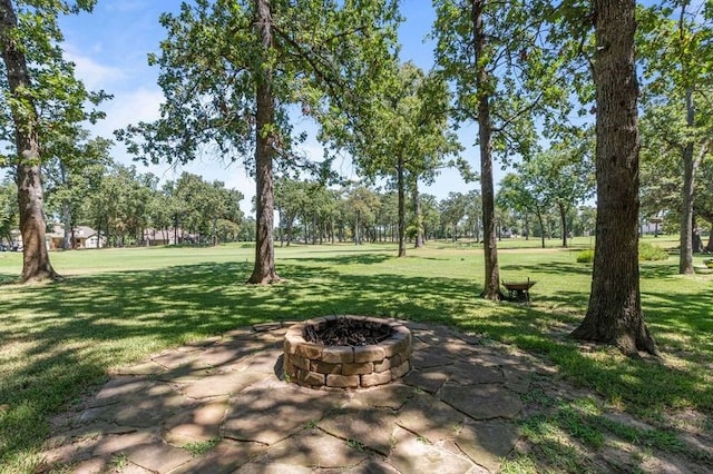 view of yard with a patio area and an outdoor fire pit