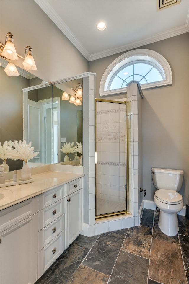 bathroom with crown molding, vanity, a shower with shower door, and toilet