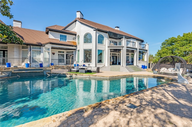 view of swimming pool with a patio area