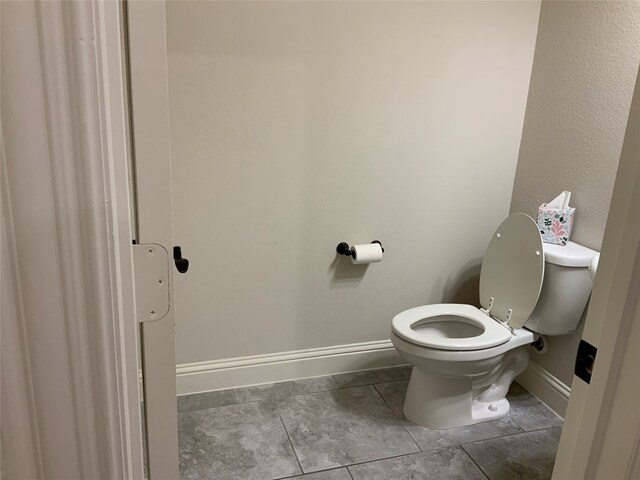 bathroom featuring tile patterned floors and toilet