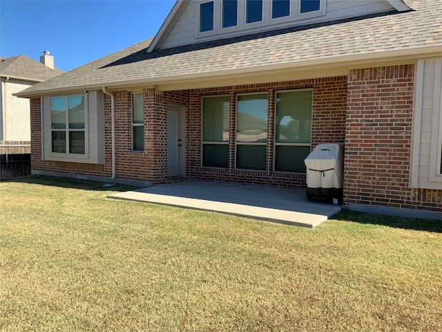 exterior space featuring a yard and a patio area