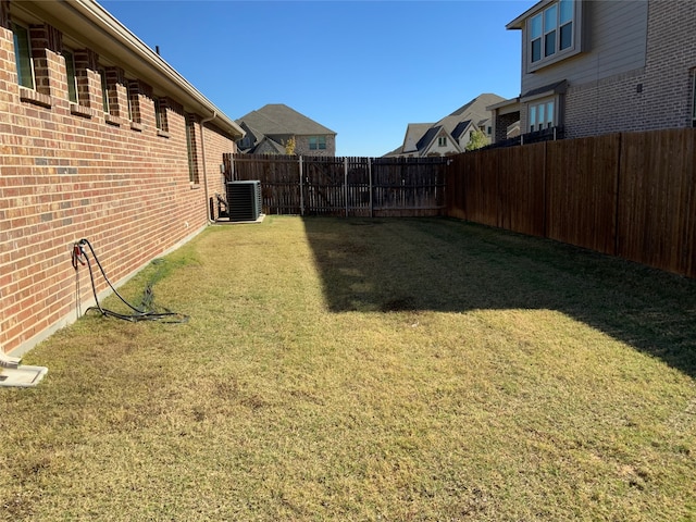 view of yard with central air condition unit