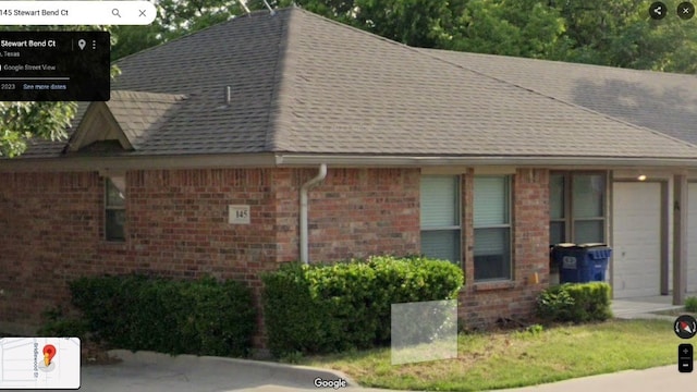 view of side of home with a garage