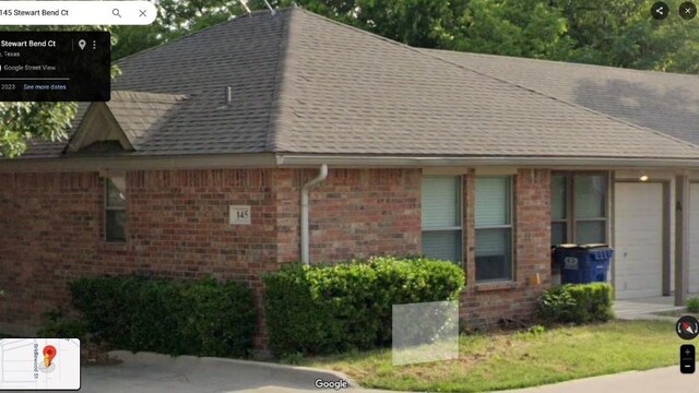 view of side of home with a garage