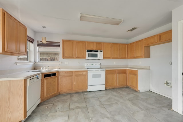 kitchen featuring sink, light tile patterned floors, pendant lighting, and white appliances