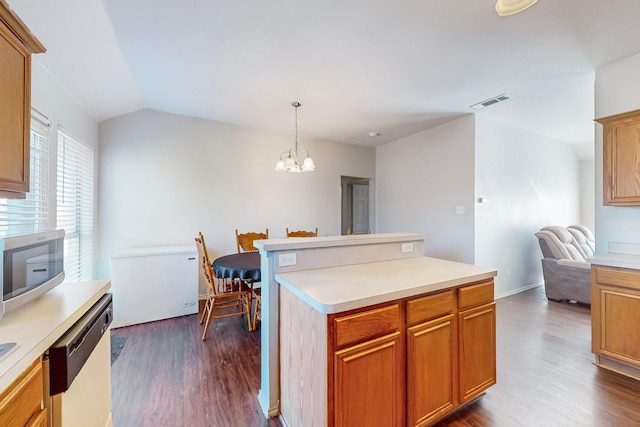 kitchen with appliances with stainless steel finishes, dark hardwood / wood-style flooring, pendant lighting, a notable chandelier, and lofted ceiling