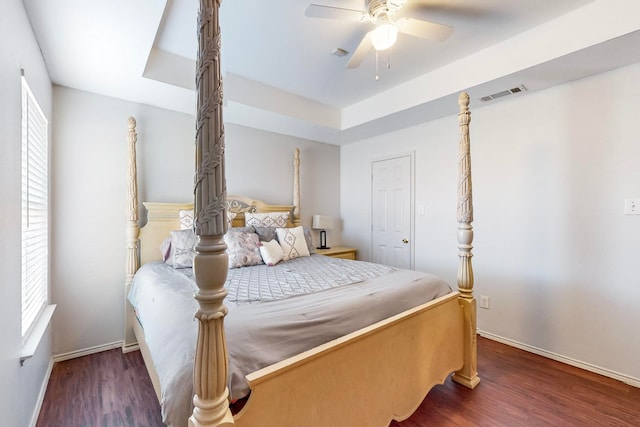 bedroom featuring dark hardwood / wood-style floors and ceiling fan