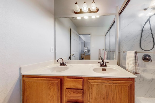 bathroom with vanity and a shower