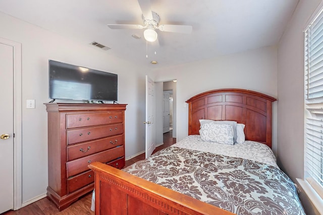 bedroom with hardwood / wood-style floors and ceiling fan