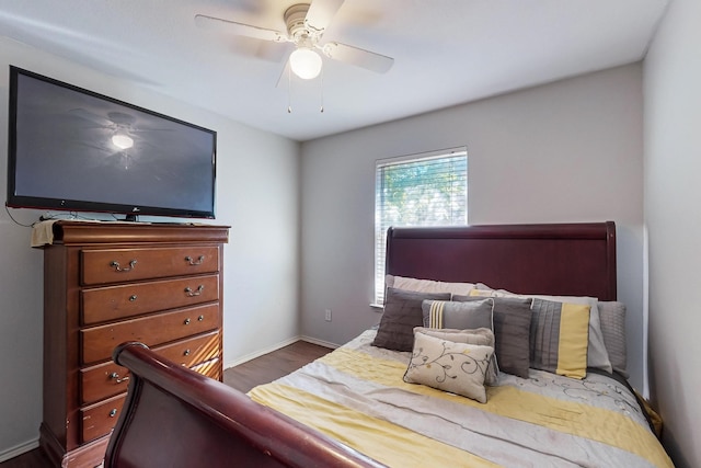 bedroom with ceiling fan and dark hardwood / wood-style floors