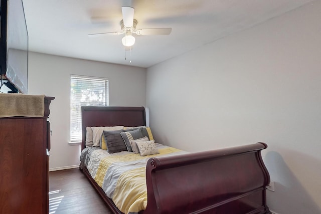 bedroom featuring ceiling fan and dark hardwood / wood-style flooring