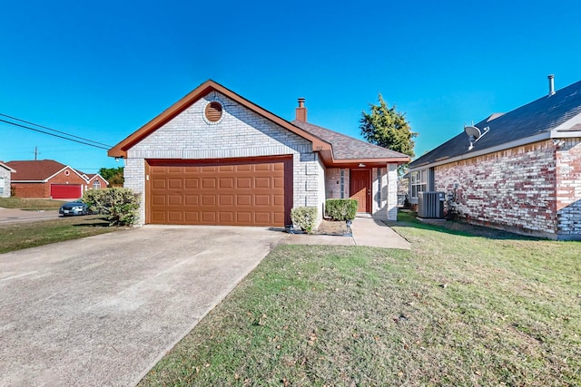 view of front of house featuring a front lawn, a garage, and cooling unit