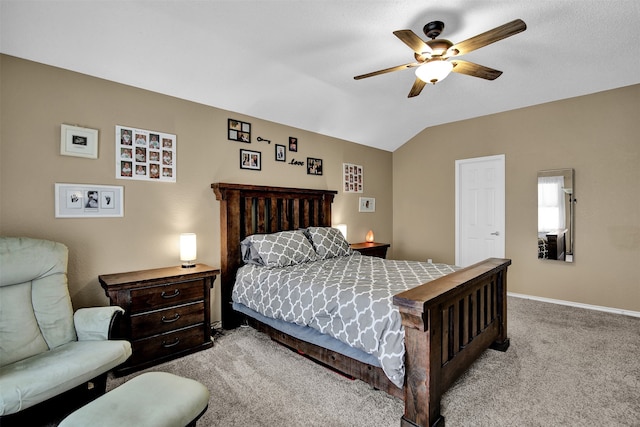 carpeted bedroom with ceiling fan and lofted ceiling