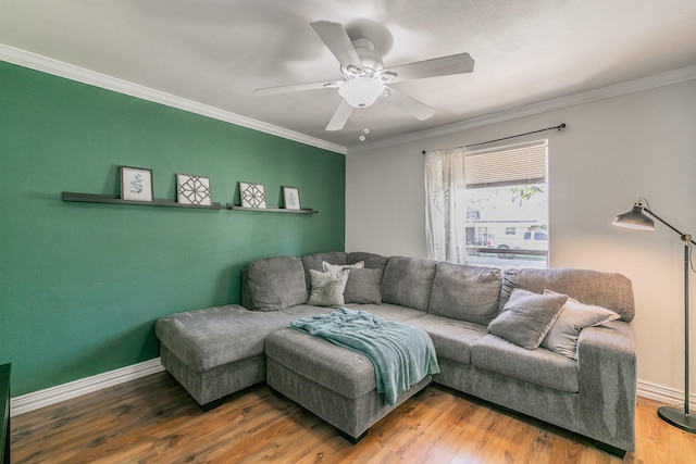 living room featuring crown molding, ceiling fan, and wood-type flooring