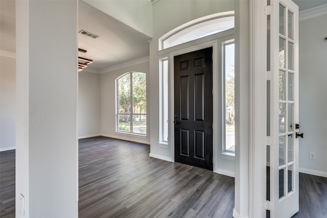 foyer entrance featuring dark hardwood / wood-style flooring and ornamental molding