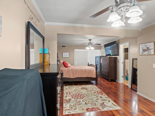 bedroom featuring ceiling fan, ornamental molding, and dark wood-type flooring