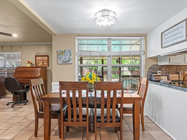 dining space featuring a notable chandelier, plenty of natural light, and light tile patterned floors