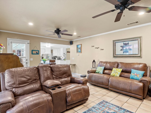 living room featuring ceiling fan, ornamental molding, and light tile patterned floors