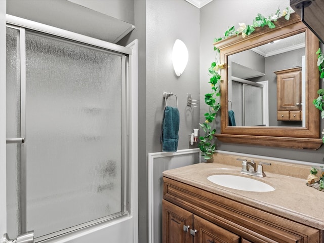 bathroom with crown molding and vanity