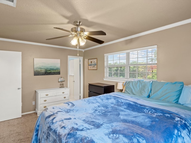 carpeted bedroom featuring a textured ceiling, ceiling fan, and crown molding