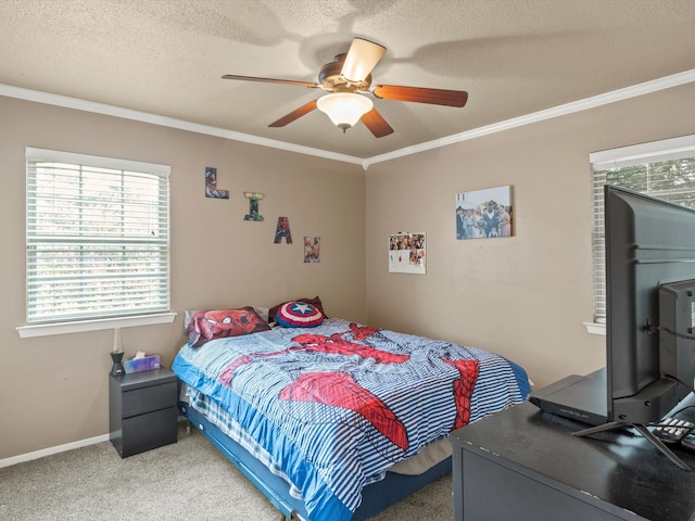 bedroom featuring carpet floors, ceiling fan, and crown molding