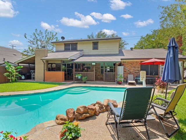 view of swimming pool with a patio