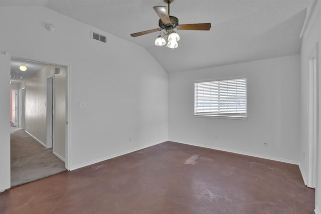 empty room featuring a textured ceiling, ceiling fan, and lofted ceiling