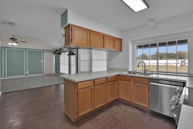 kitchen featuring sink, stainless steel dishwasher, ceiling fan, a textured ceiling, and kitchen peninsula