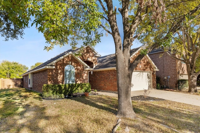 single story home featuring a front yard and a garage