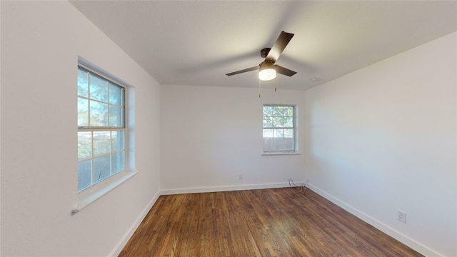 spare room featuring ceiling fan and dark hardwood / wood-style flooring