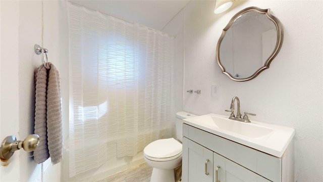 full bathroom featuring vanity, toilet, and shower / bathtub combination with curtain