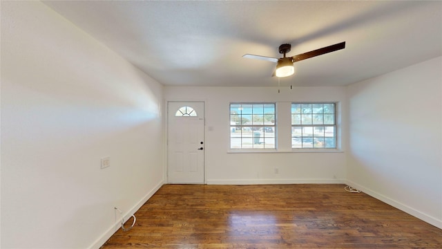 foyer entrance featuring ceiling fan and dark hardwood / wood-style flooring