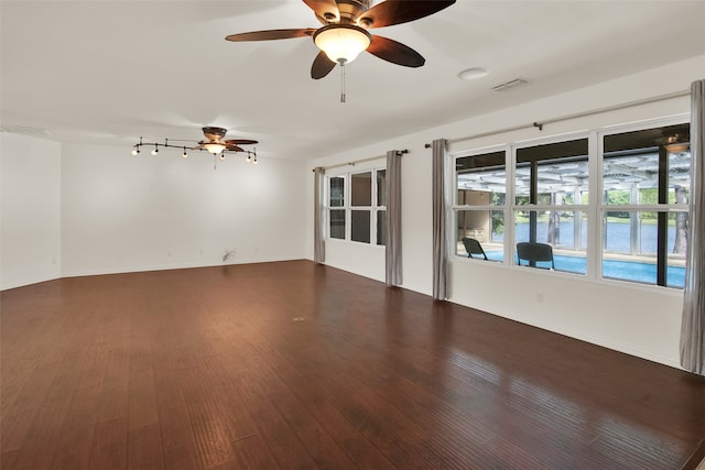 unfurnished room featuring hardwood / wood-style flooring and ceiling fan